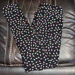 LulaRoe One Size Popsicle leggings, black background, fits 2-10